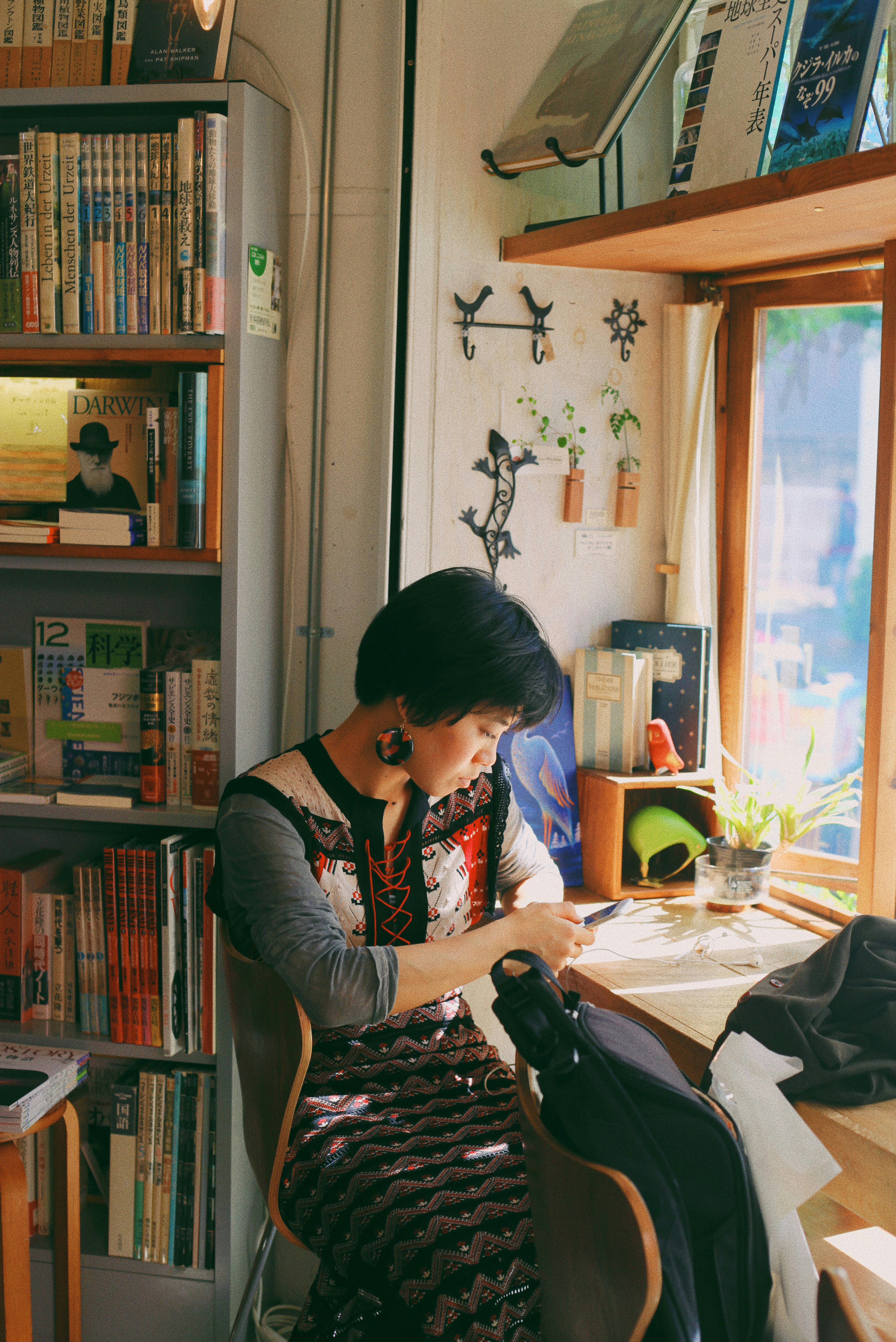 woman sitting on chair in front of table